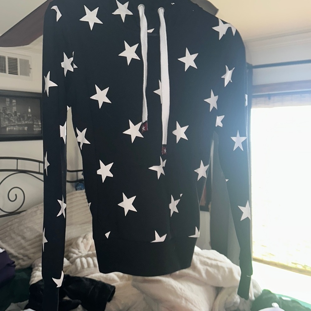 Brand new small hoodie black with white stars has kangaroo pocket